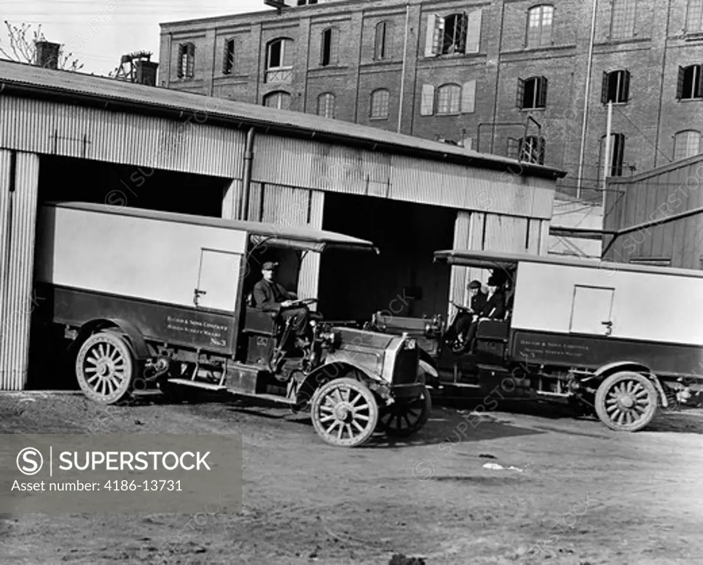 1910S 1920S Pair Of Delivery Drivers One Pulling Truck Into & One Pulling Truck Out Of Garage