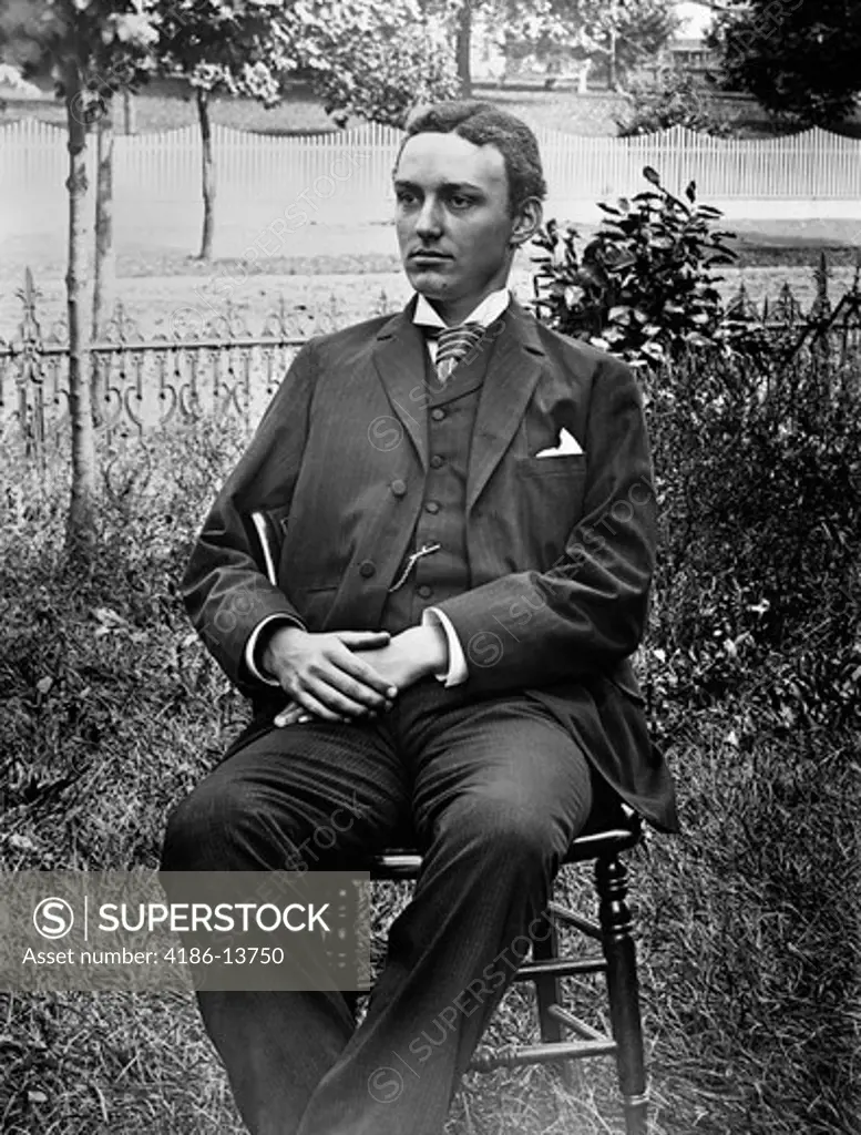 1890S 1900S Turn Of The Century Portrait Of Man In Three-Piece Suit Seated In Chair Outside