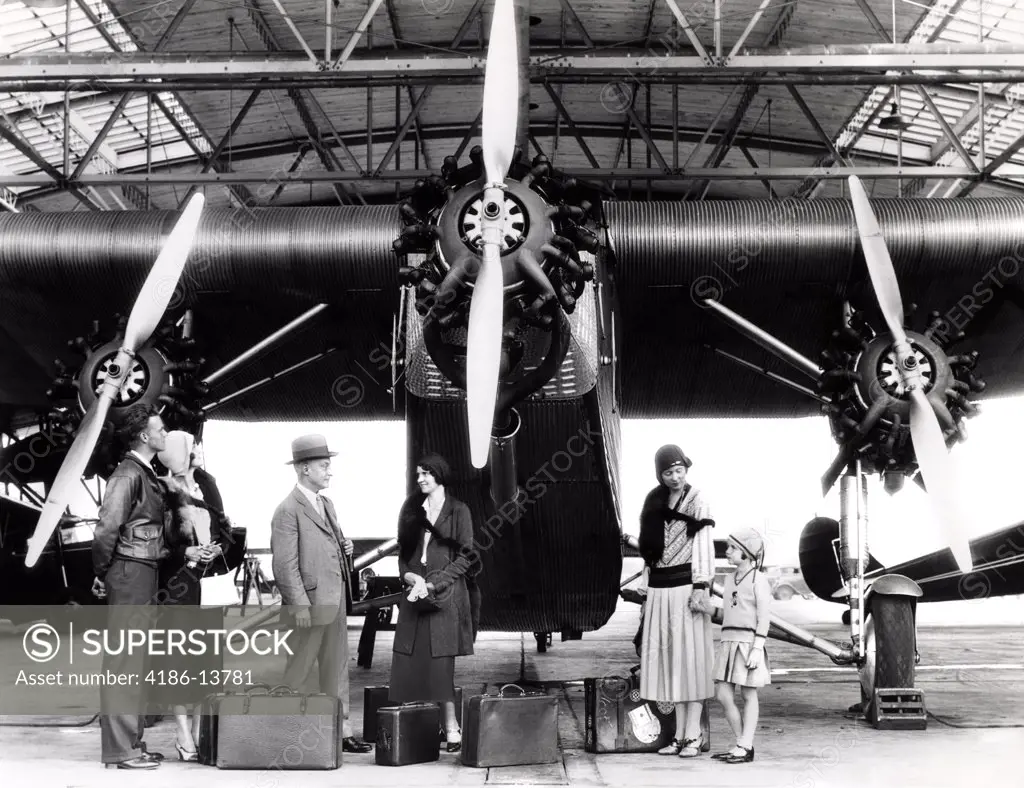 1920S 1930S Group Of Passengers Waiting In Front Of Ford Tri-Motor Airplane