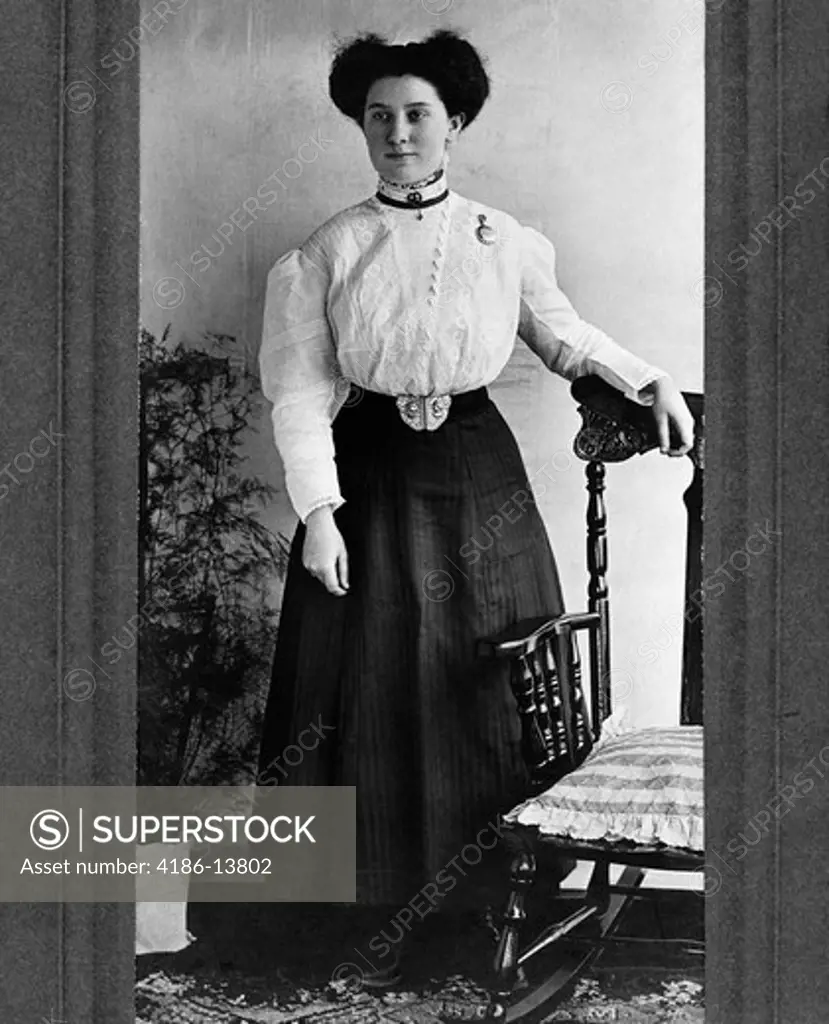 1890S 1900S Turn Of The Century Full-Length Portrait Woman With Hand Resting On Rocking Chair