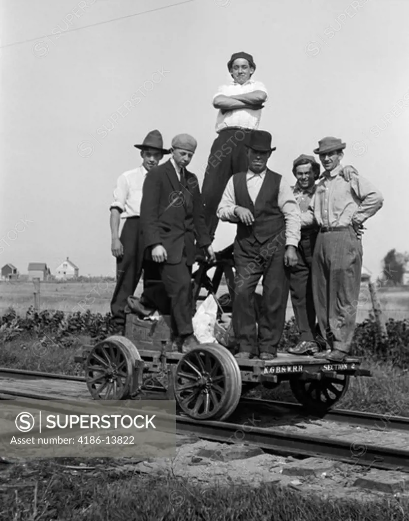 1890S 1900S Portrait Group Of Men Railroad Workers Standing On Handcar Outdoor