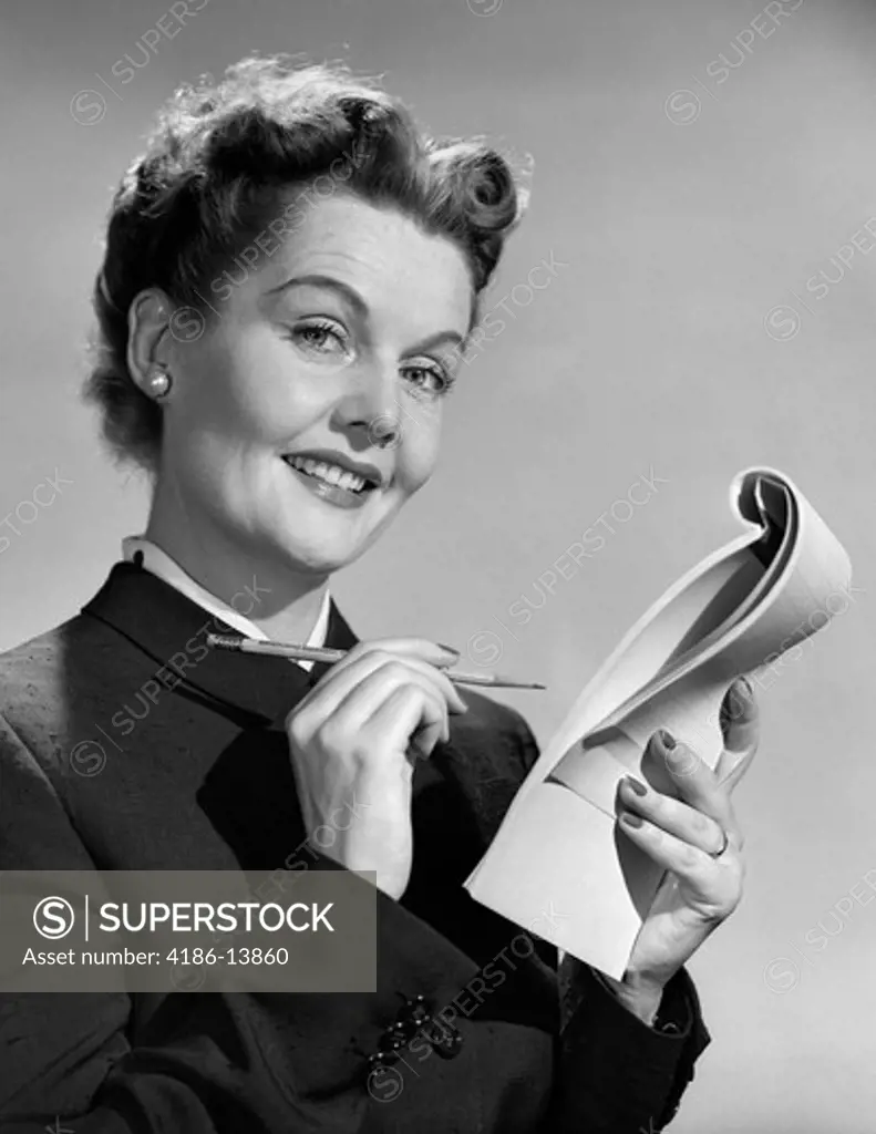 1950S Smiling Woman Business Secretary Taking Notes With Pencil On Pad