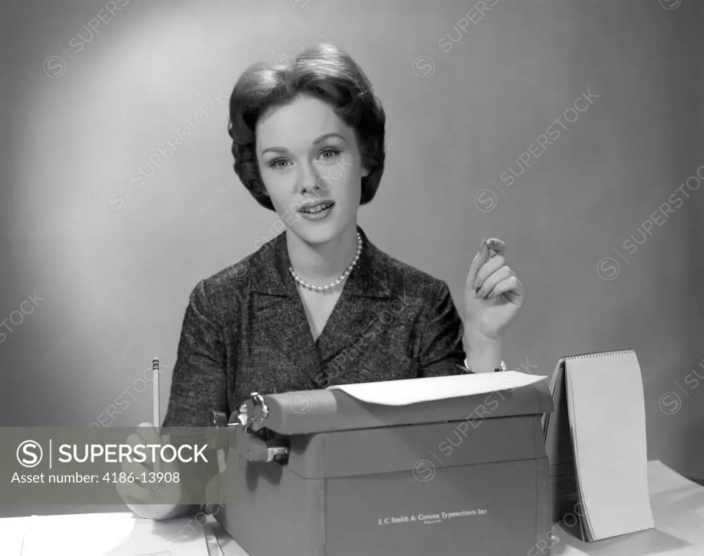 1960S Portrait Secretary Seated Behind Typewriter With Steno Book To Side & Pencil In Hand