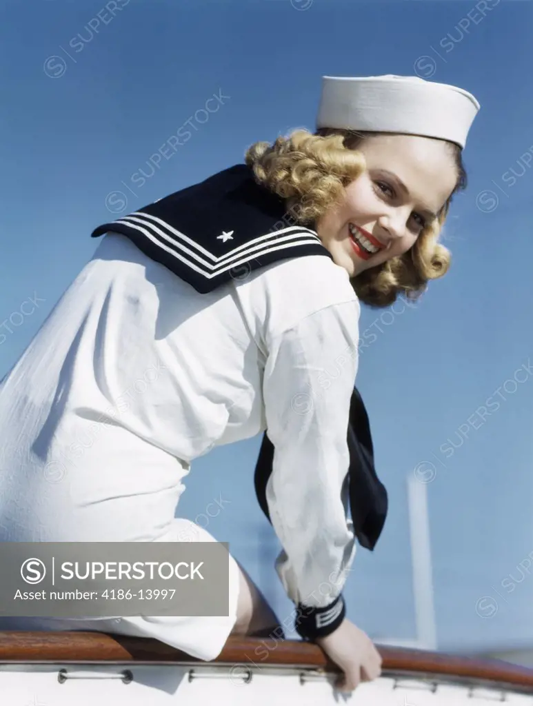 1940S 1950S Smiling Blond Woman In Sailor Outfit Looking Over Her Shoulder