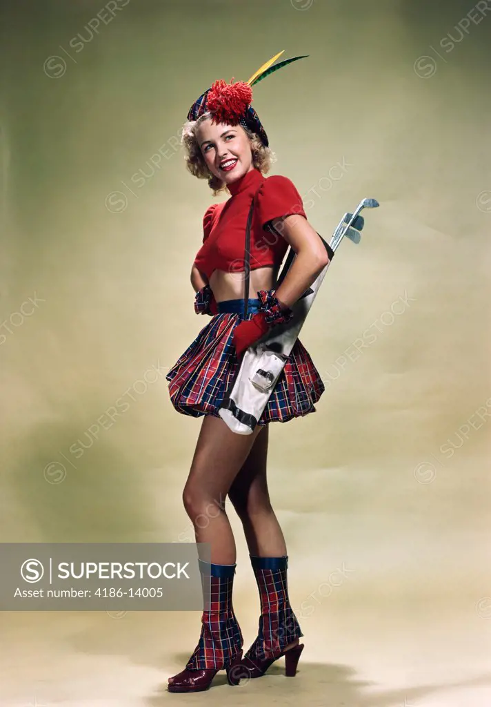 1940S 1950S Portrait Smiling Blond Woman Pinup Wearing Plaid Tam Red Cropped Sweater Plaid Skirt And Boots Holding Golf Clubs Over Shoulder