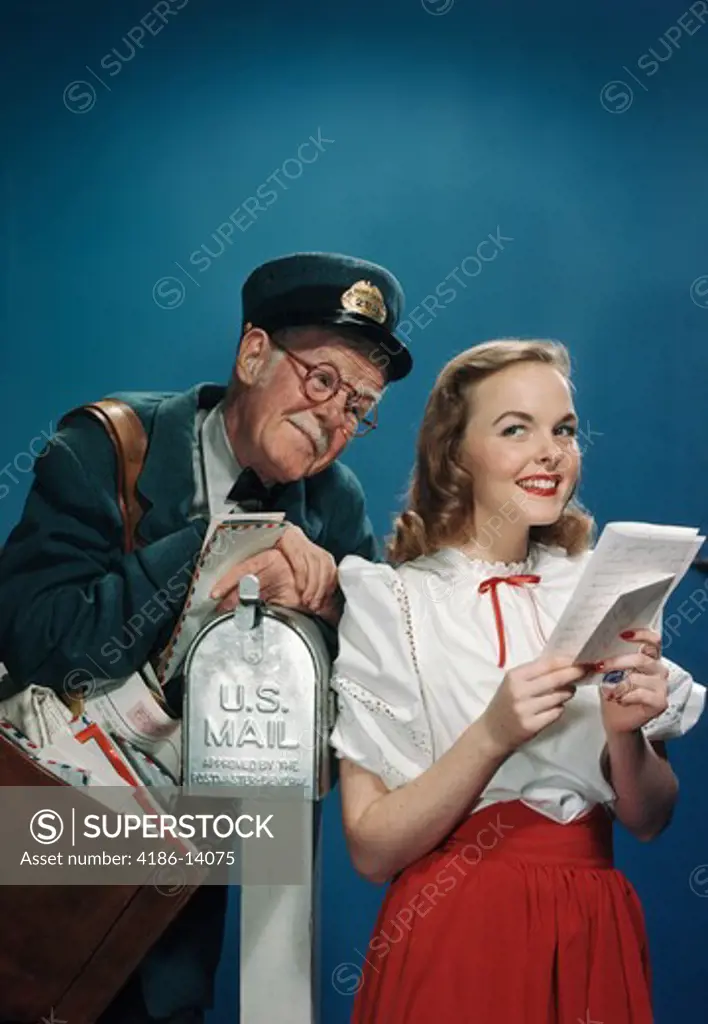 1940S 1950S Elderly Mailman Reading Over The Shoulder Of Young Woman Holding Letter