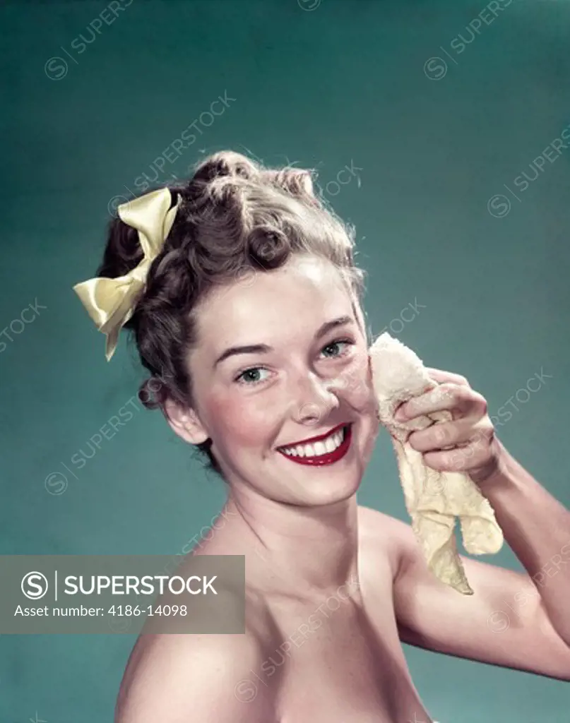 1940S 1950S Portrait Smiling Teen Girl Washing Face With Washcloth