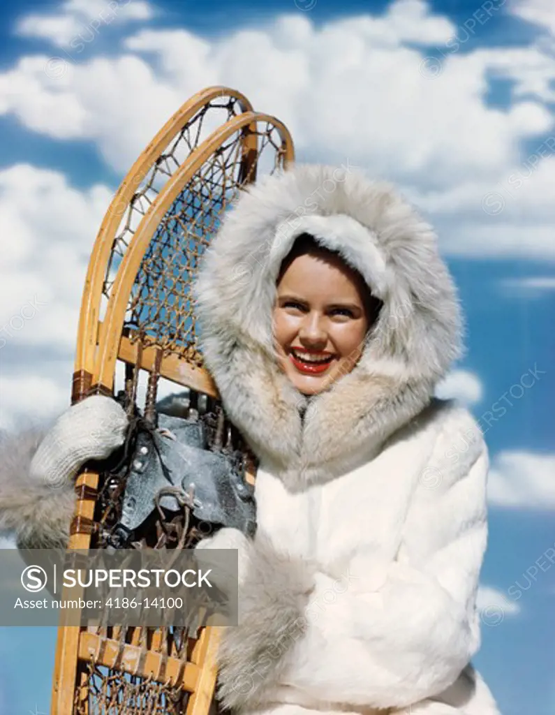 1940S 1950S Woman White Fur Parka Holding Pair Of Snow Shoes