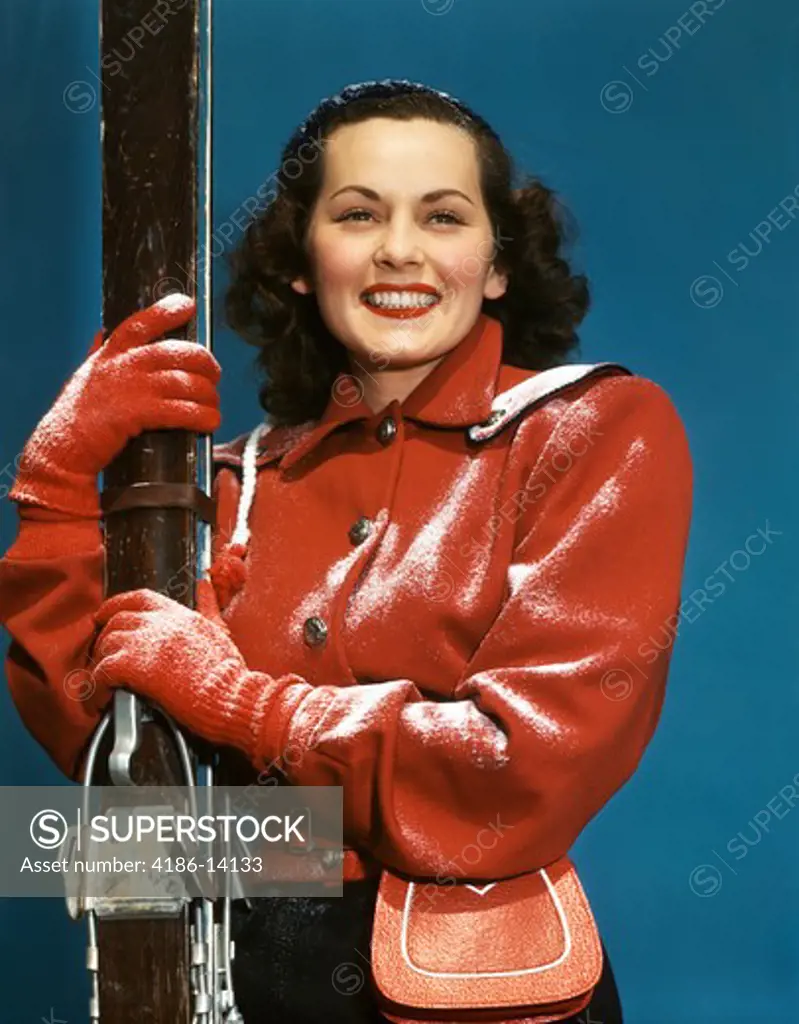 1940S 1950S Smiling Brunette Woman With Skis Red Jacket Lightly Dusted With Snow