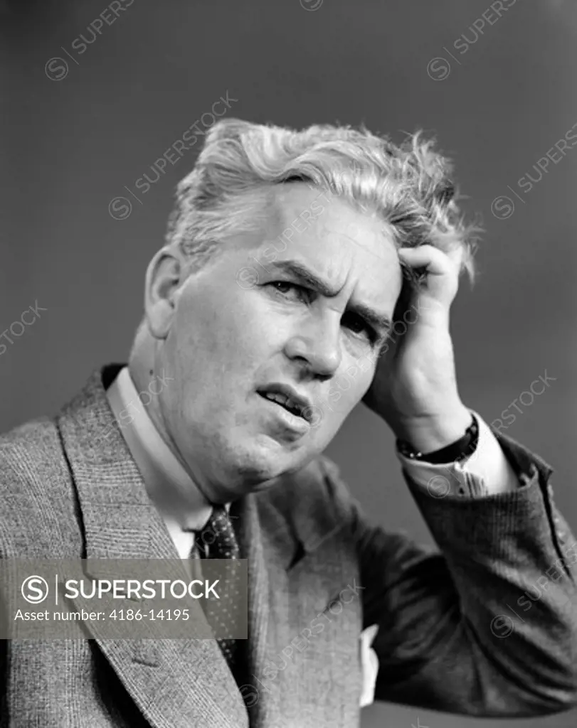 1930S 1940S Man Portrait Hand Held Up To Head Facial Expression Forgetful Confused Contemplative Suit Tie Business
