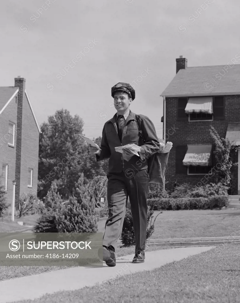1950S Postal Mailman Walking Suburban Street Wearing Uniform Delivering Mail