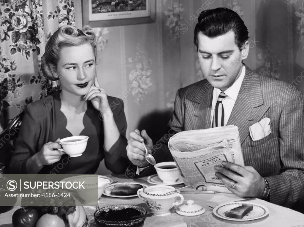 1940S Couple Breakfast Table Impatient Woman Looking At Man Reading Newspaper