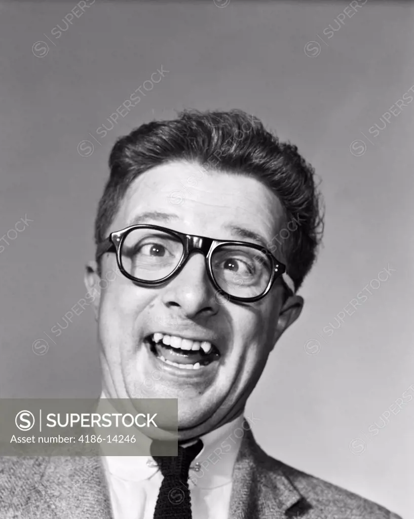 1960S Man Wearing Black Plastic Frame Eye Glasses Making A Goofy Expression