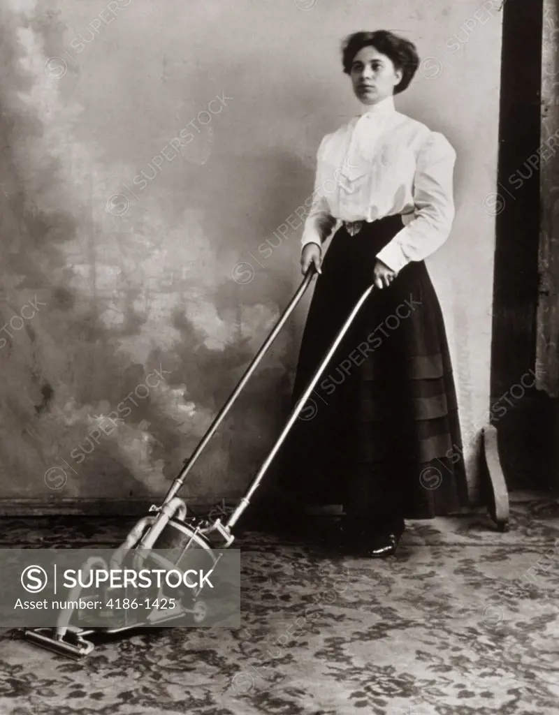 1900S Woman Using Vacuum Cleaner