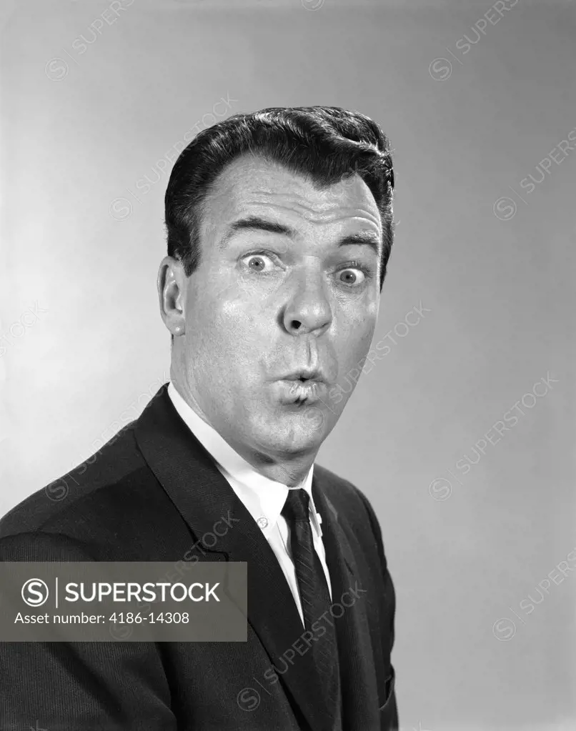 1960S Man Suit Tie Making Funny Face Facial Expression Lips Pursed Eyes Wide