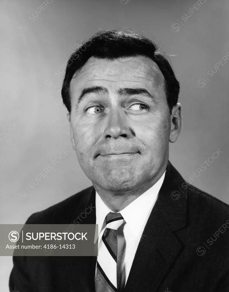 1960S Businessman Making Funny Face Looking To The Side