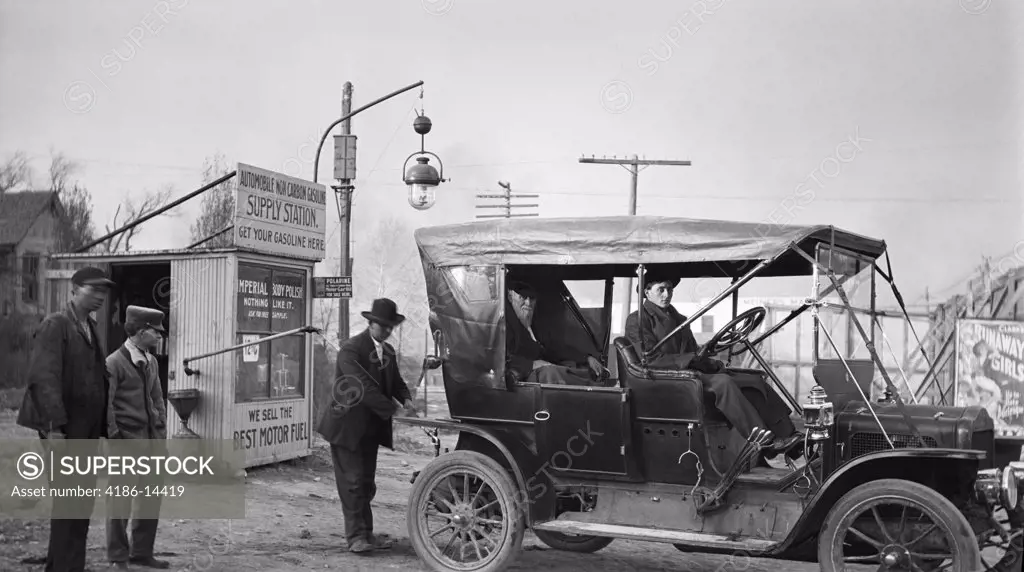 1910S Kansas City Missouri Man Filling Tank Of Old Car At Gasoline Station Next To The Old Santa Fe Trail