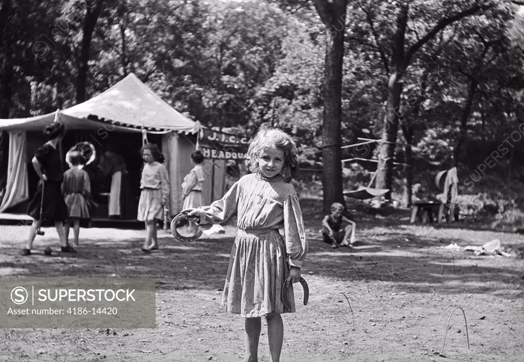 1910S Little Girl Pitching Horseshoes In A Girls Summer Camp Kansas City Missouri