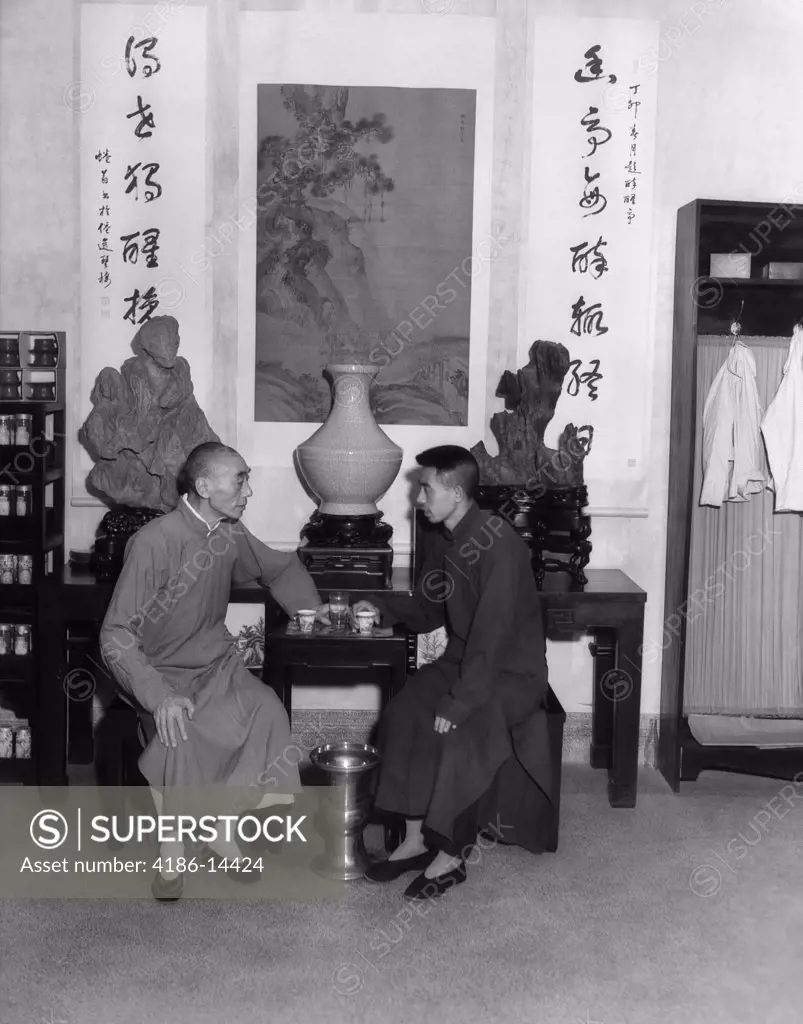 1920S 1930S Two Chinese Men Sampling Tea In House Of Wang Tea Shop In Hangchow China