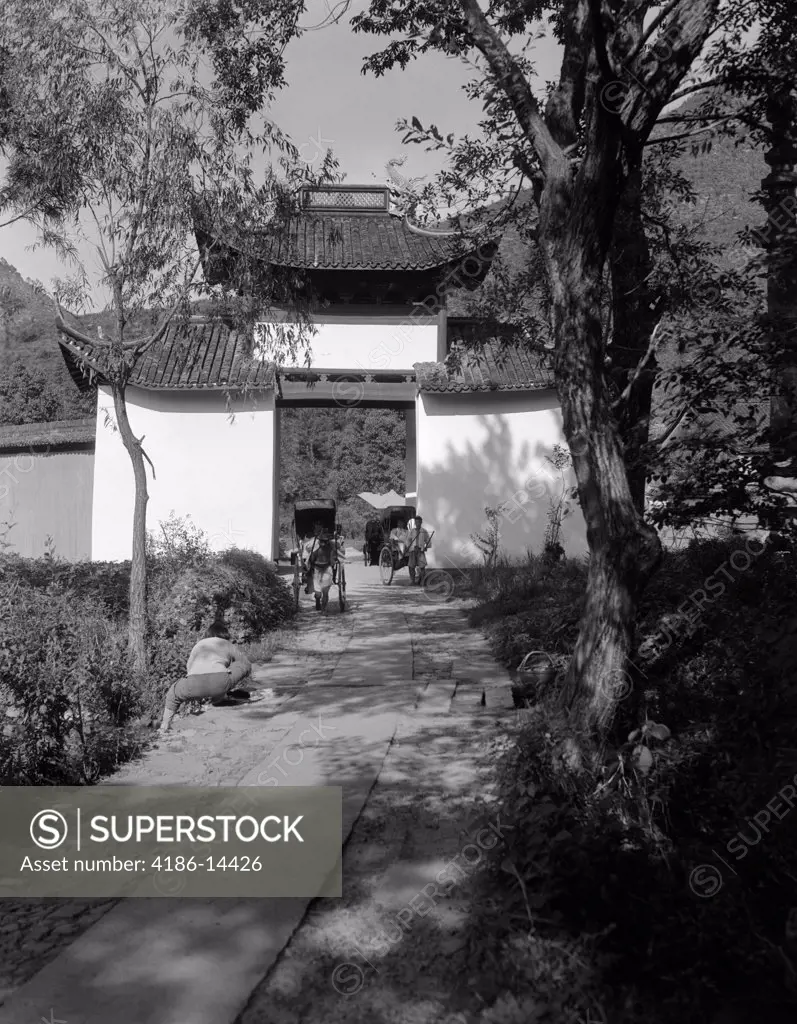 1920S 1930S Two Rickshaws Coming Through Gateway Arch Into Temple Garden Scenic Hangchow China
