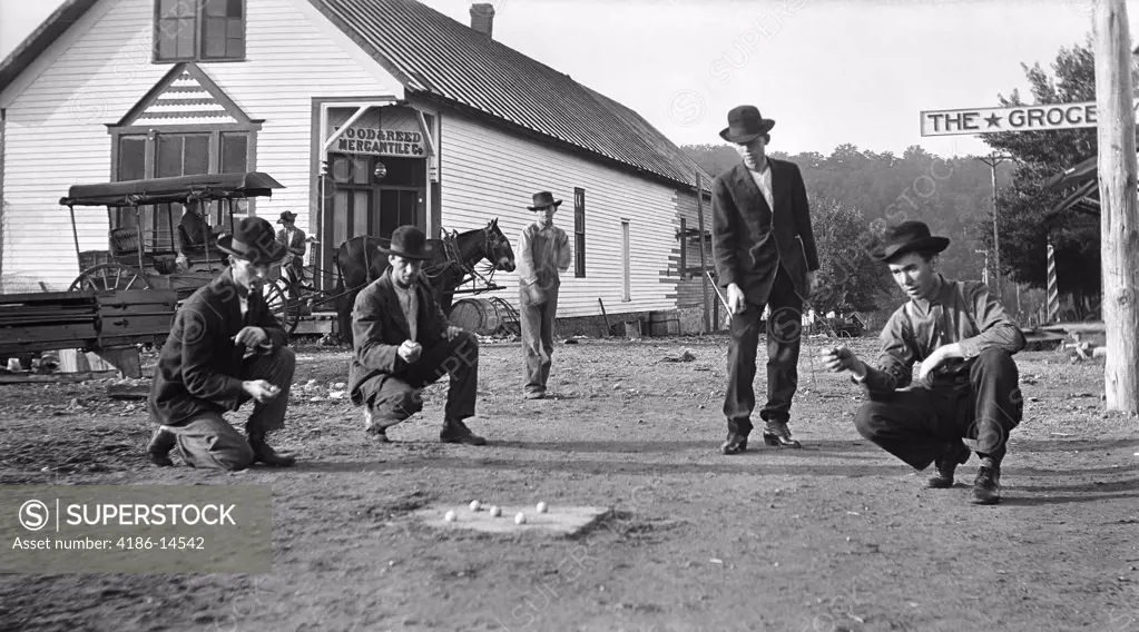1910S Men Playing Marbles Game Of Hoss In On Streets Of Gainsville Missouri In The Ozark Hill Country