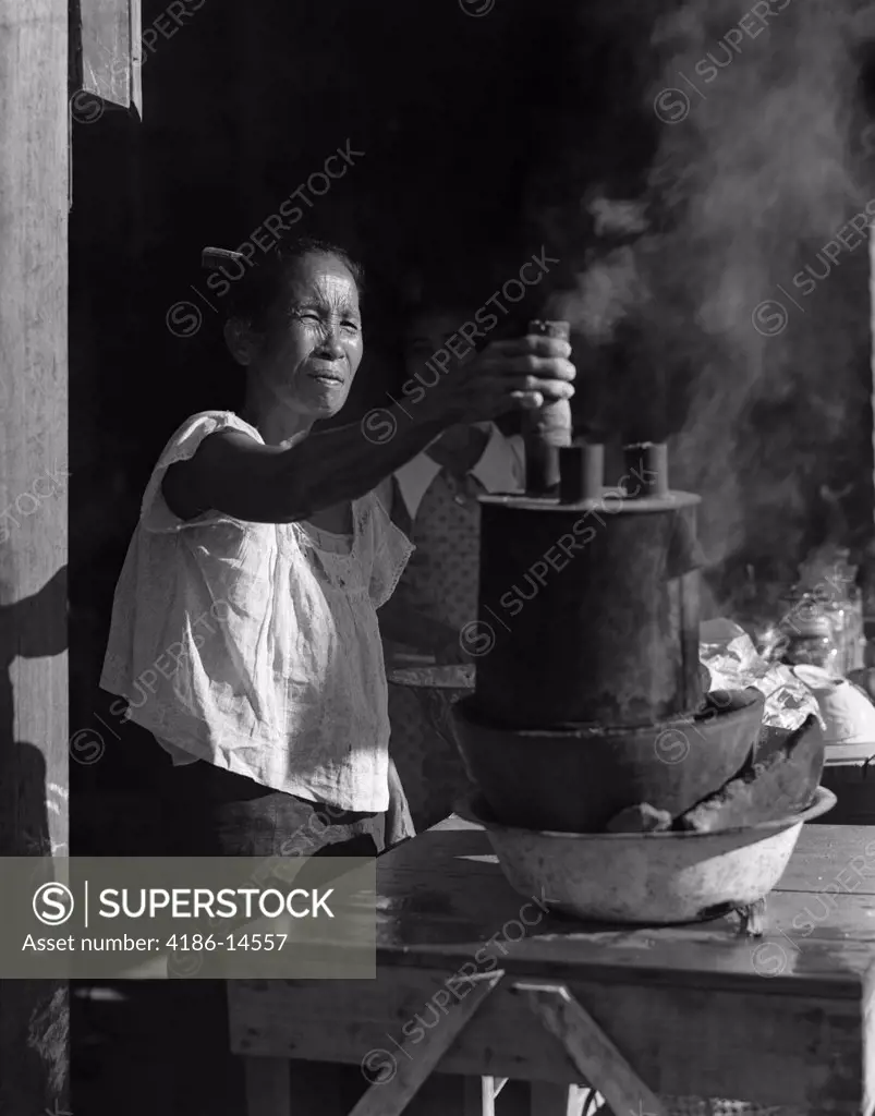 1930S Filipino Woman Cooking Adjusting Steaming Pot Making Rice Candy Manila Philippines