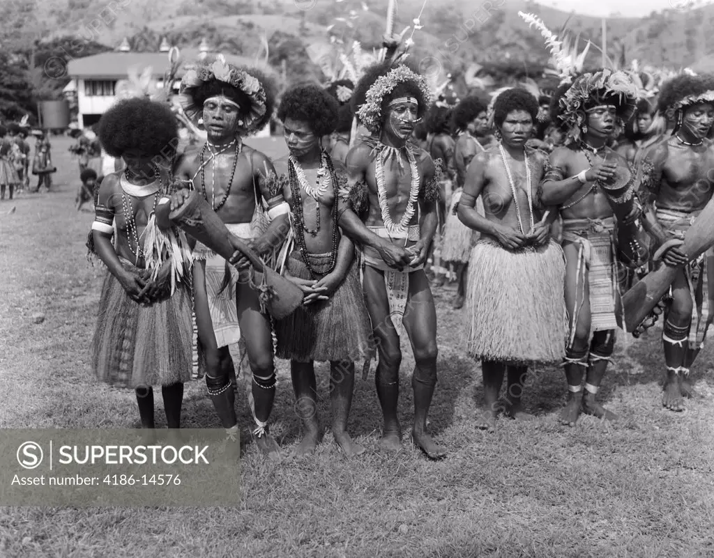1920S 1930S Group Of Native Papuan Dancers In Costume Grass Skirt Music Folk Dance Port Moresby New Guinea