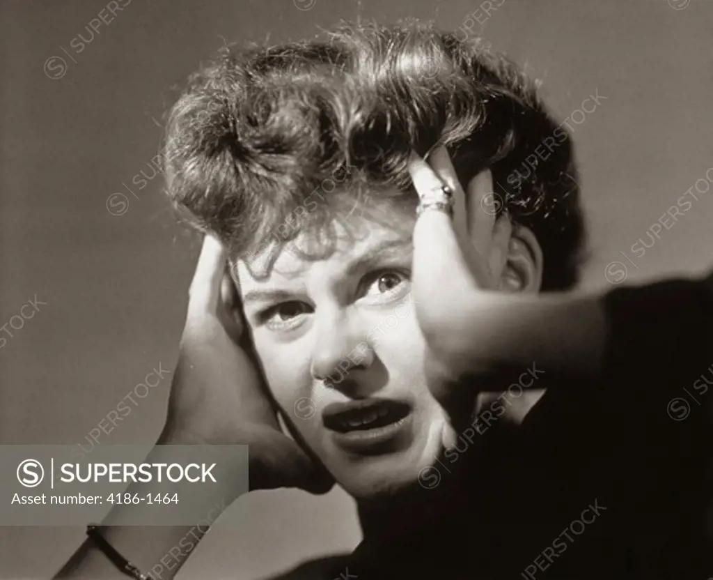 1950S Scared Frightened Woman With Hands To Head
