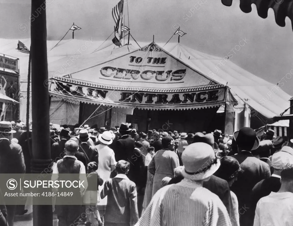 1920S 1930S Back View Of Crowds Entering Circus Tent Main Entrance