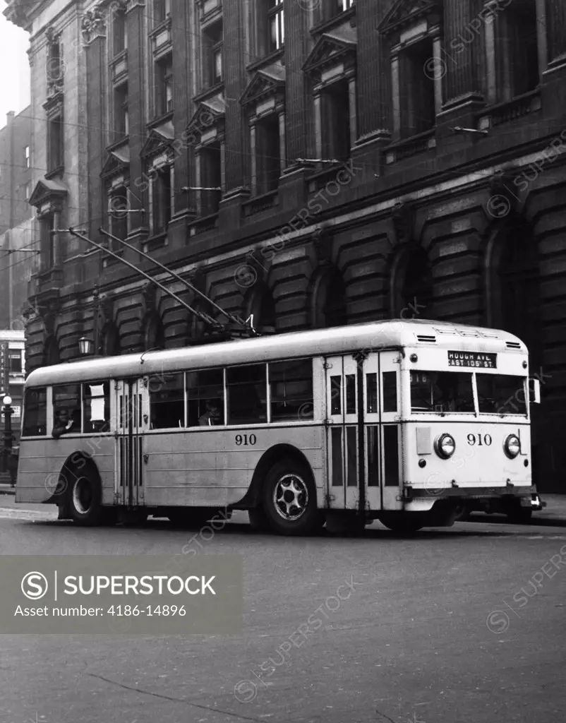 1930S 1940S Trackless Trolley Electric Bus About To Round Curve Public Transportation Cleveland Ohio Usa