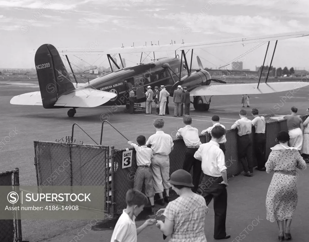 1930S Passengers Boarding American Airlines Condor Biplane Airplane For Commercial Flight From Newark New Jersey Usa Airport
