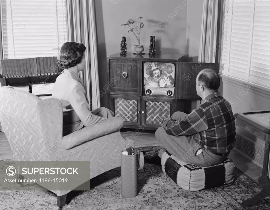 1950S Couple Husband Wife Watching Console Television In Living Room