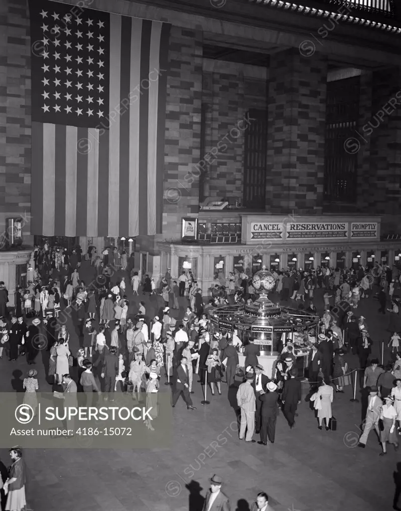 1940S Crowd Grand Central Station Large American Flag Hanging On Wall Ticket Windows Information Booth Commuters Travel