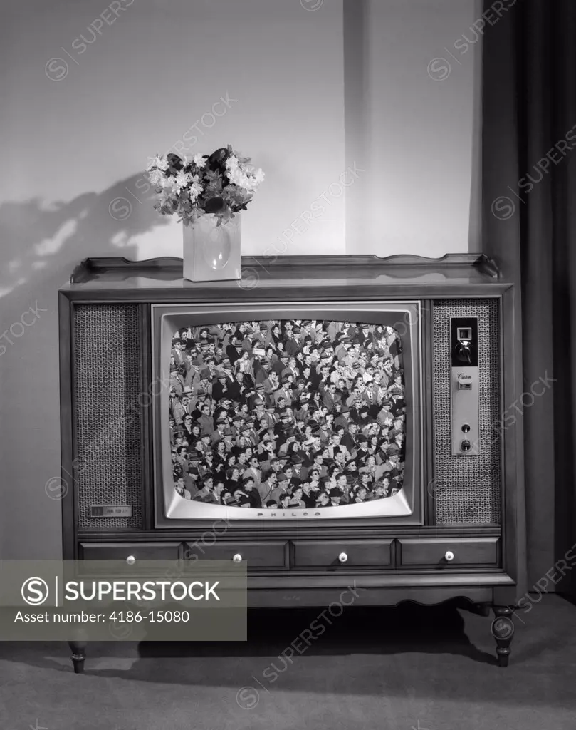 1960S Head-On View Of Tv Set With Crowds In Bleachers On Screen