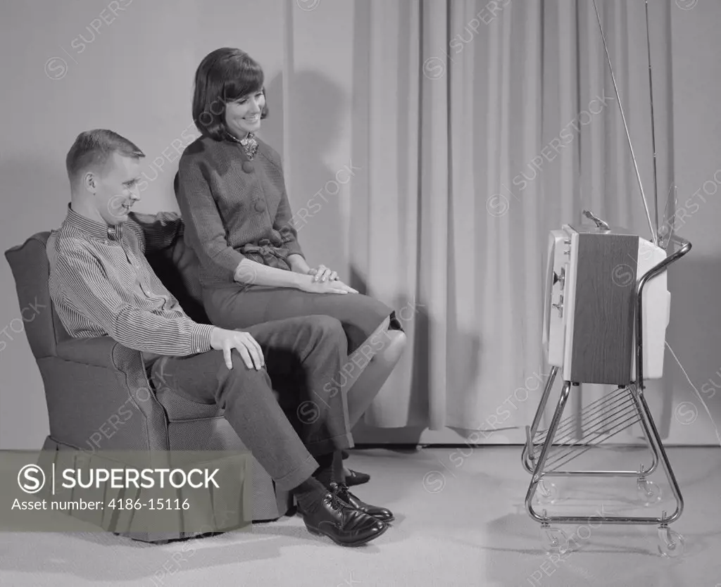 1960S Couple Man Woman Sitting Chair Watching Portable Television