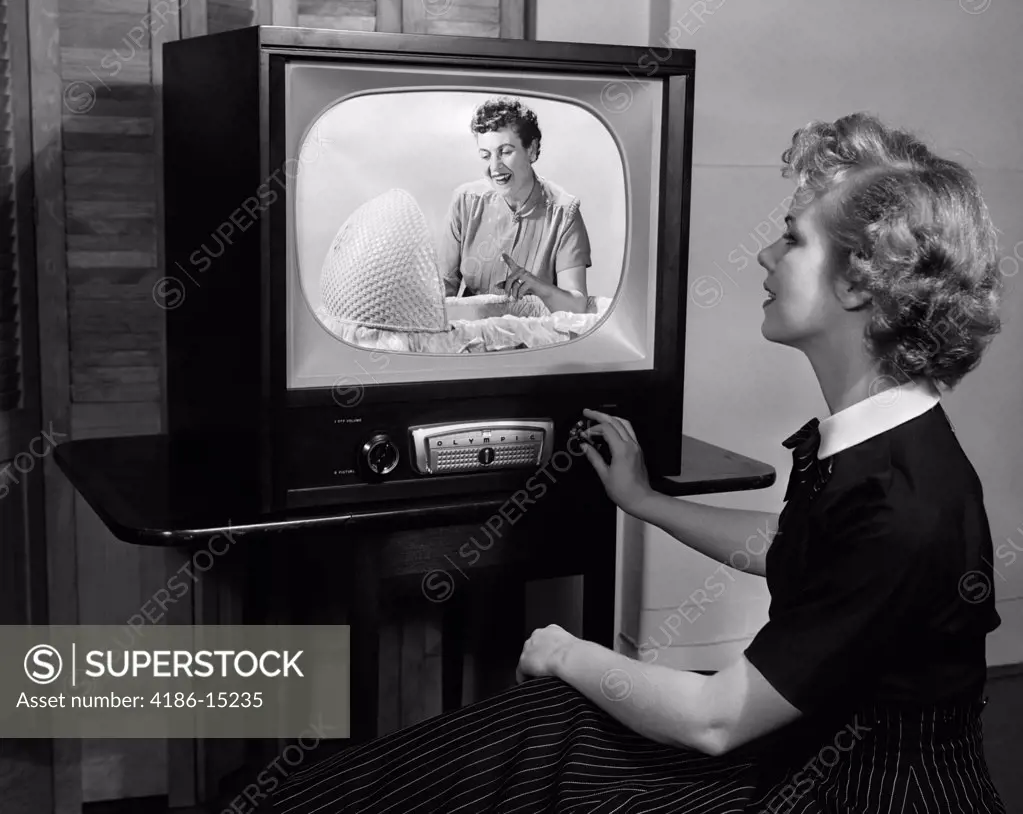 1950S Blonde Woman Turning Dial On Tv Set Studio Indoor