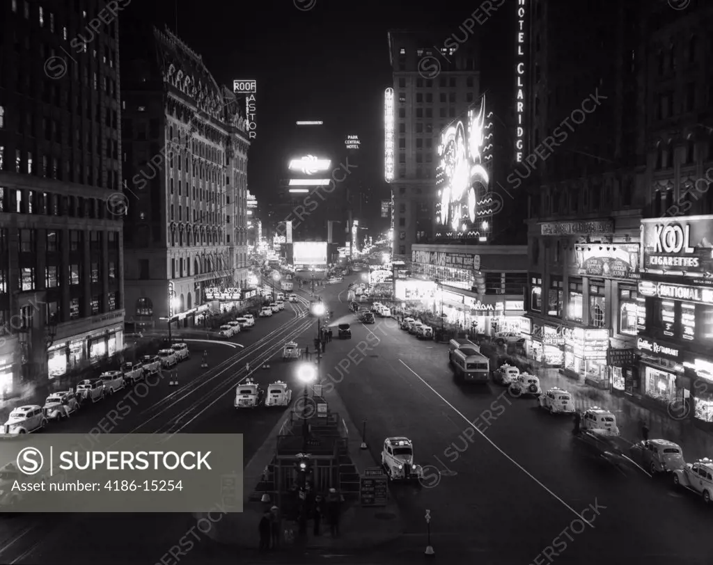 1930S Overhead Of Times Square Lit Up At Night With Cars Lining Curbs