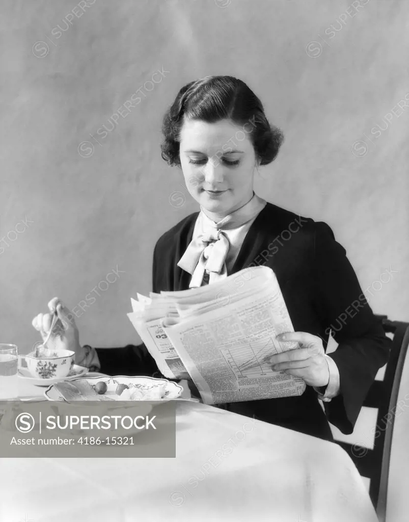 1930S Woman Reading Newspaper Eating Breakfast