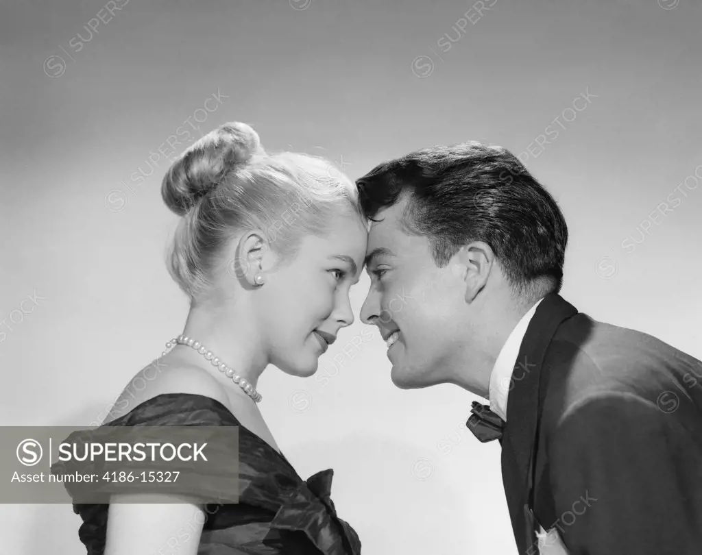 1950S Man Woman Couple Foreheads Touching Profile Formal Attire Tuxedo Pearls Smiling Nose To Nose Date Flirt