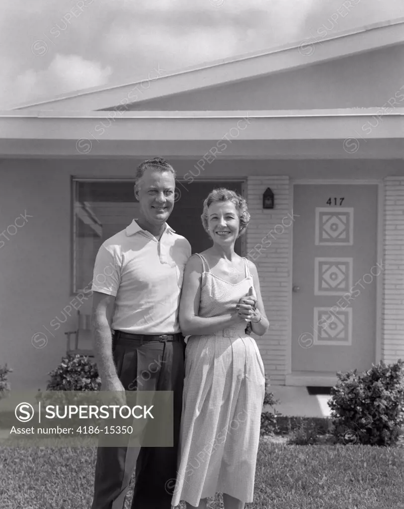 1950S Smiling Older Man Woman Senior Citizen Standing Together In Retirement Home Front Yard