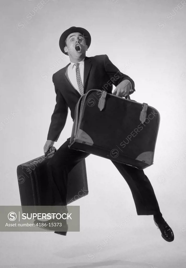 1950S 1960S Man Salesman Businessman With Two Suitcases Running Jumping Excited