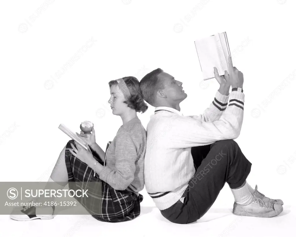 1950S 1960S Teenage High School Couple Boy & Girl Students Leaning Back To Back Dating Studying Reading Books