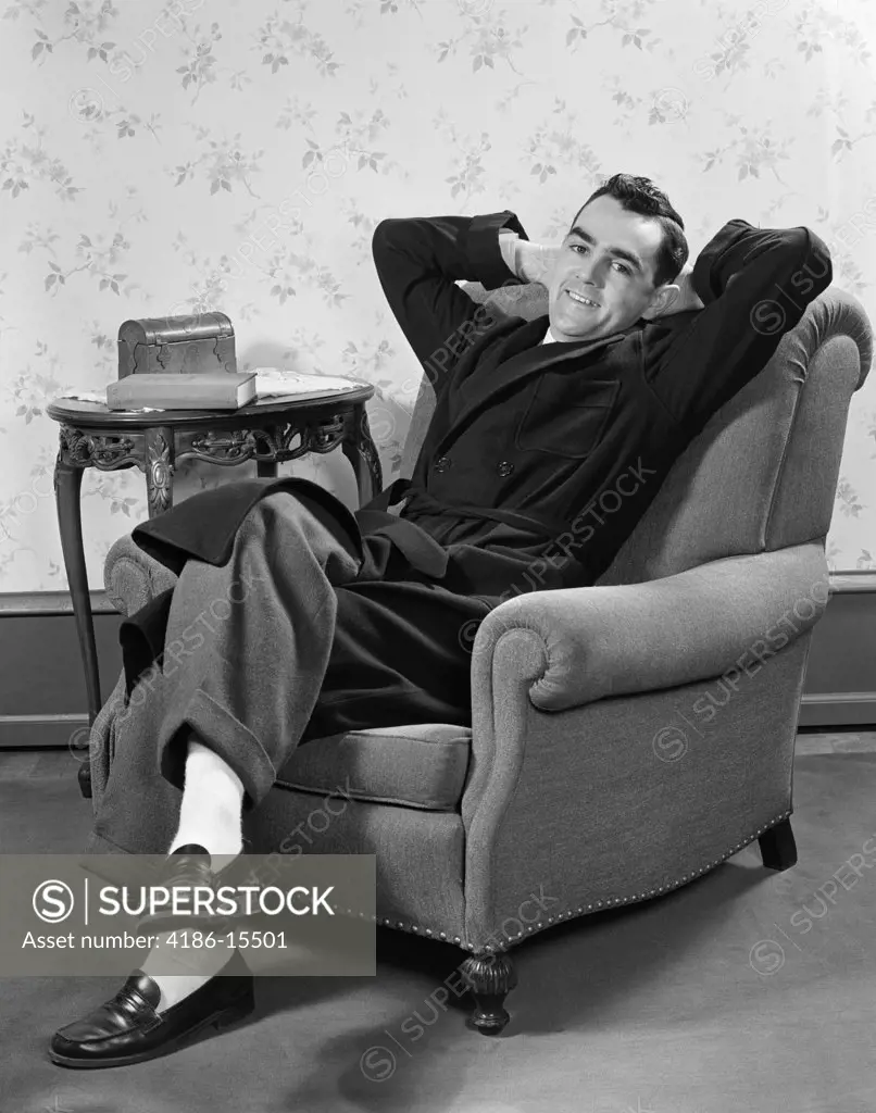 1940S Man In Robe Sitting In Lounge Chair