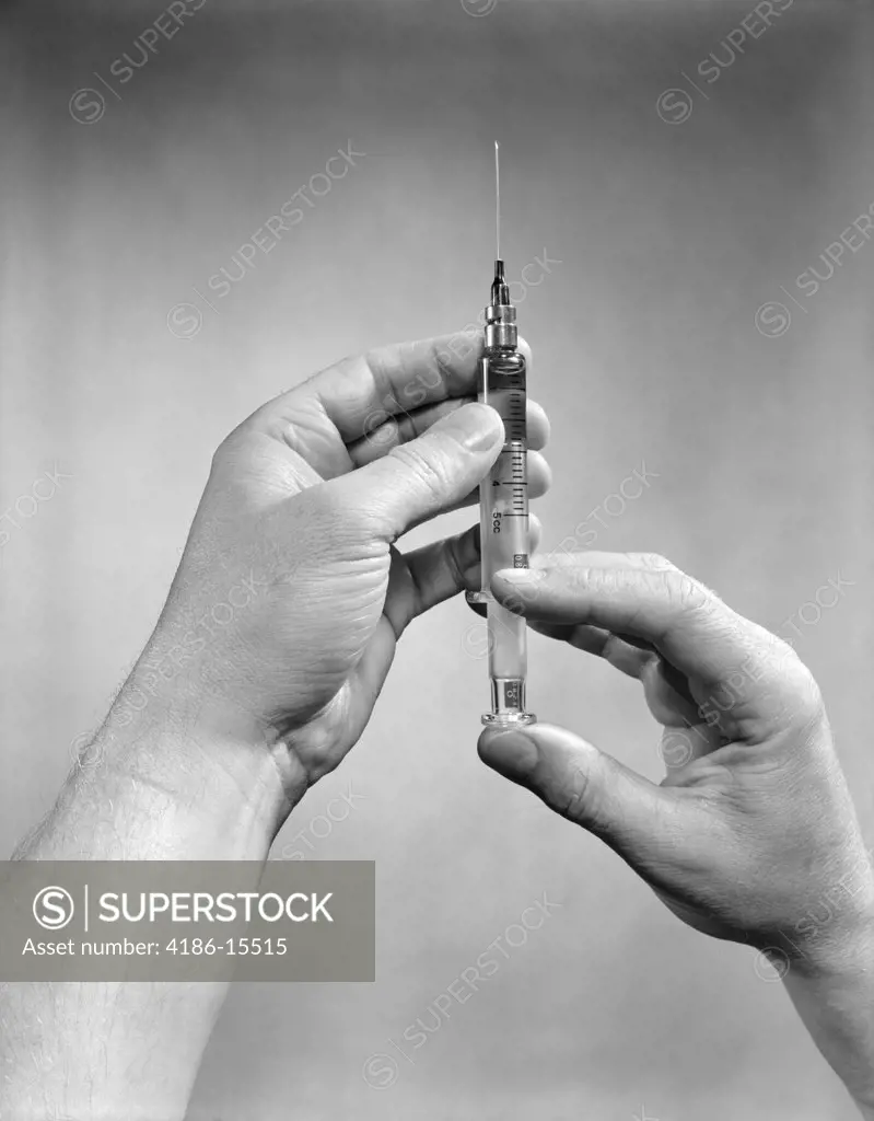 1930S 1940S 1950S Hands Preparing Drug Shot Injection Syringe
