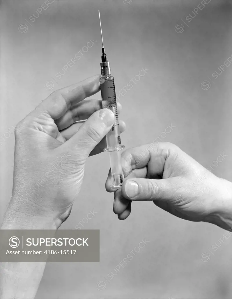 Hands Preparing Drug Shot Injection Syringe