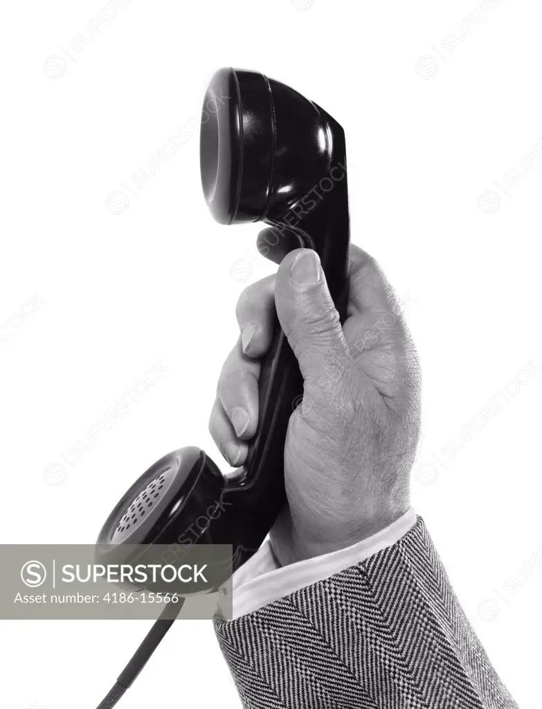 1950S Man'S Hand Holding Telephone Receiver With Herringbone Jacket Sleeve Showing