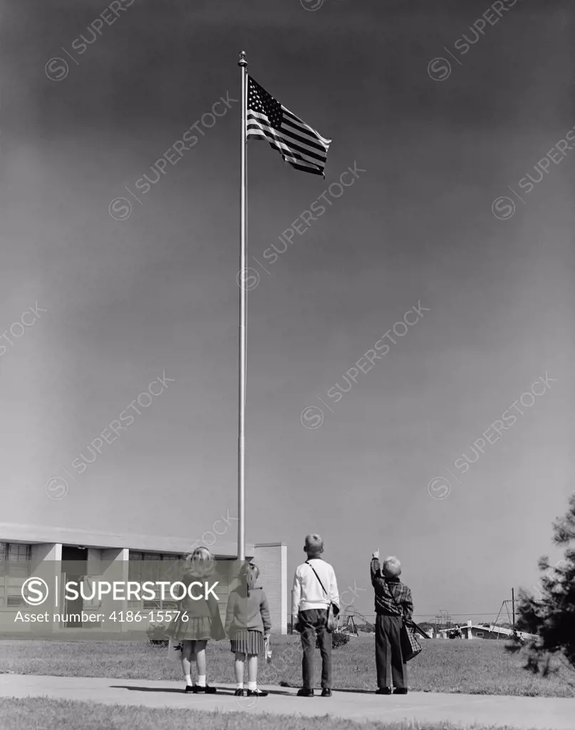 1960S Group 4 School Children Looking Up At American Flag
