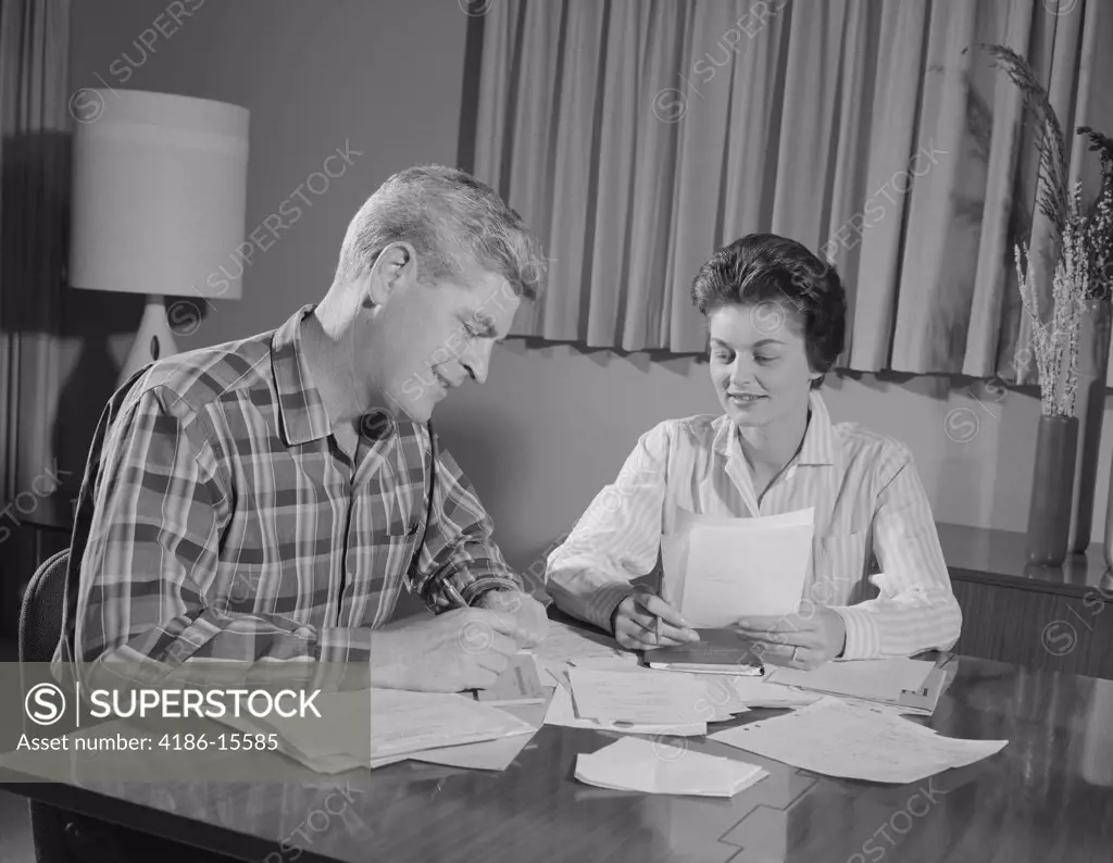 1960S Couple Man Woman At Table Working On Household Accounts Bills