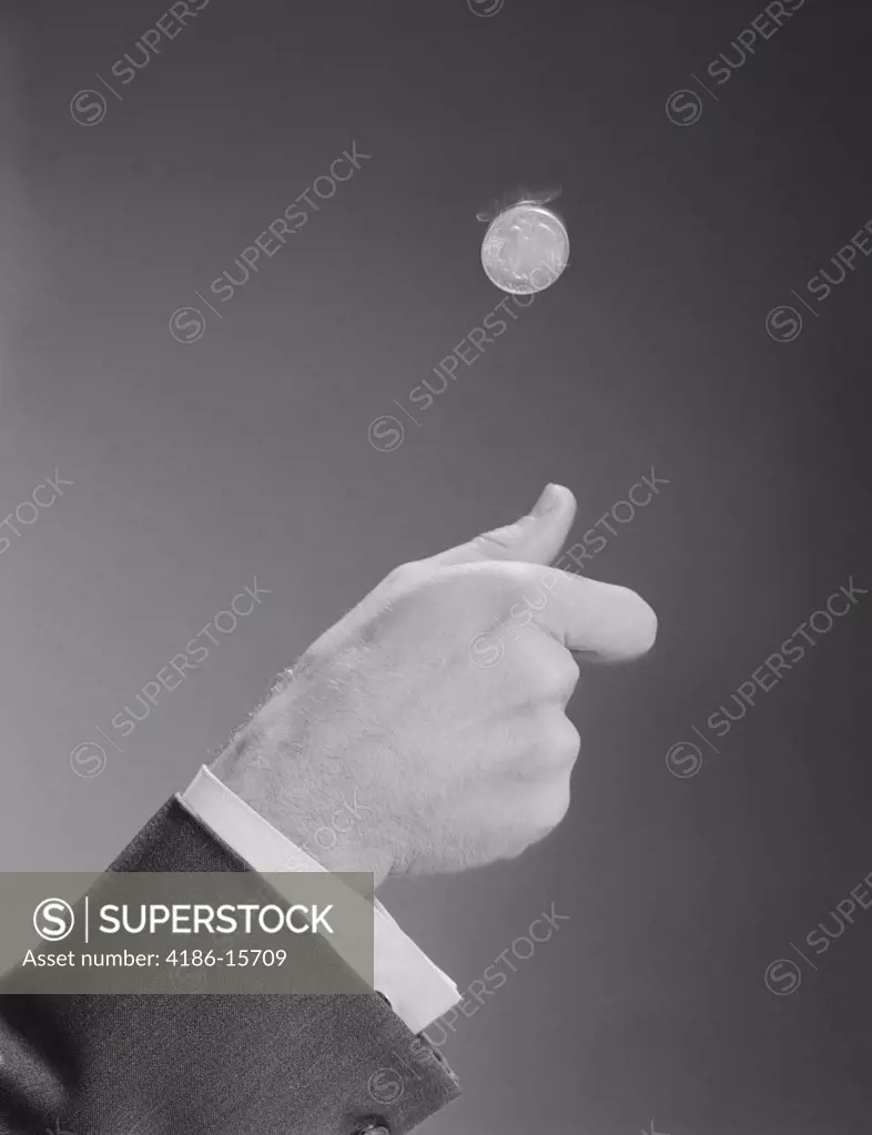 1960S Male Hand Tossing Flipping A Coin