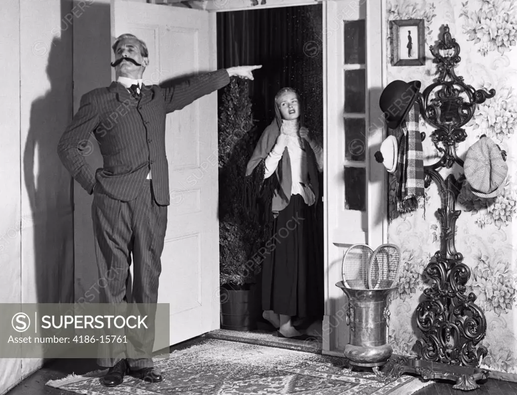 1960S Set-Up Of Victorian Man With Handlebar Mustache Banishing Woman In Doorway